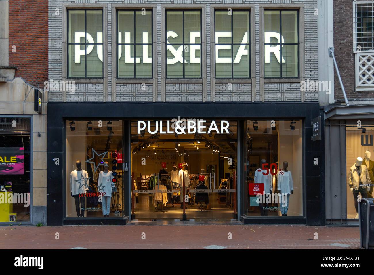 Pull & Bear sign logo and entrance store in a shopping street. Pull&Bear is a Spanish clothing and accessories. Stock Photo
