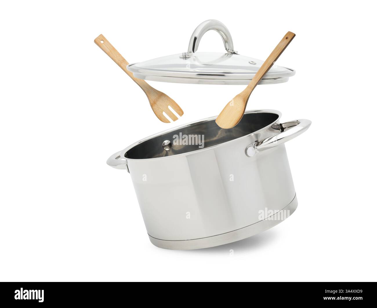 Saucepan, wooden spoon and turner in air on white background Stock ...