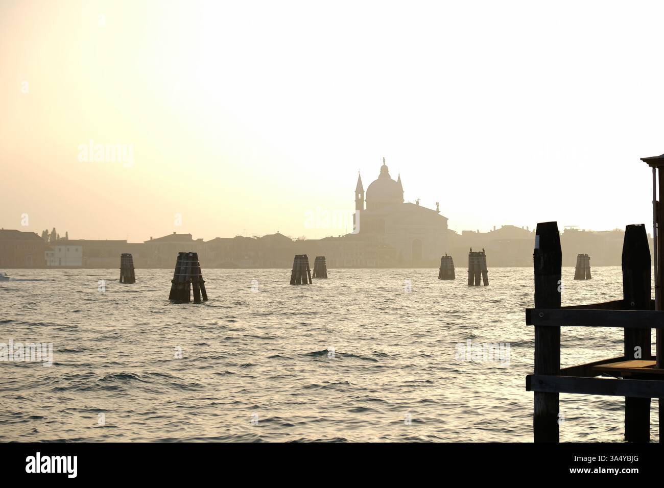 Misty sunset or sunrise over Venetian lagoon with silhouette of ...