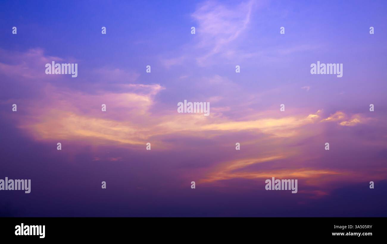 Sun shines brightly on the dark beautiful sky, Beautiful cloud at dusk over the city, Nature background, Evening sky, Sunset, Colorful cloud in summer Stock Photo