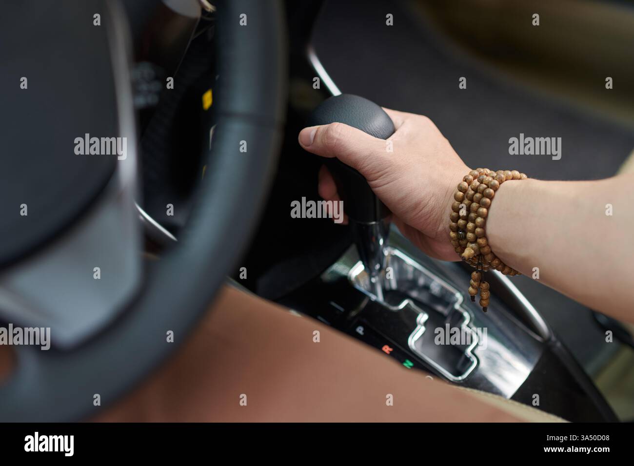 Driver handling the gearbox as he parks near a home setting. This ...