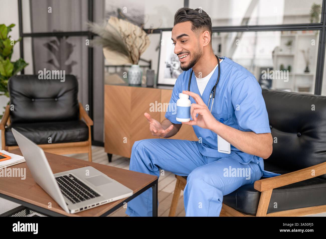 Pleased doctor vitamin bottle hi-res stock photography and images - Alamy