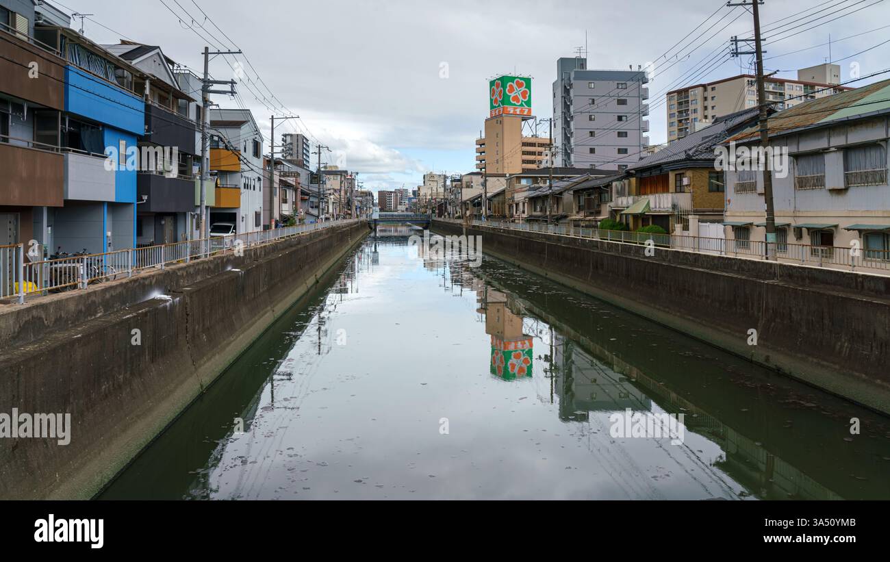 Low Rise Embankment Osaka, Japan - Sep 23 2024, panoramic view of the polluted canal, low ...