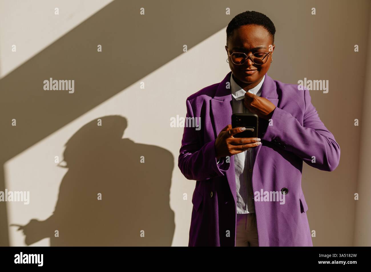 Confident african american business woman wearing suit and standing ...