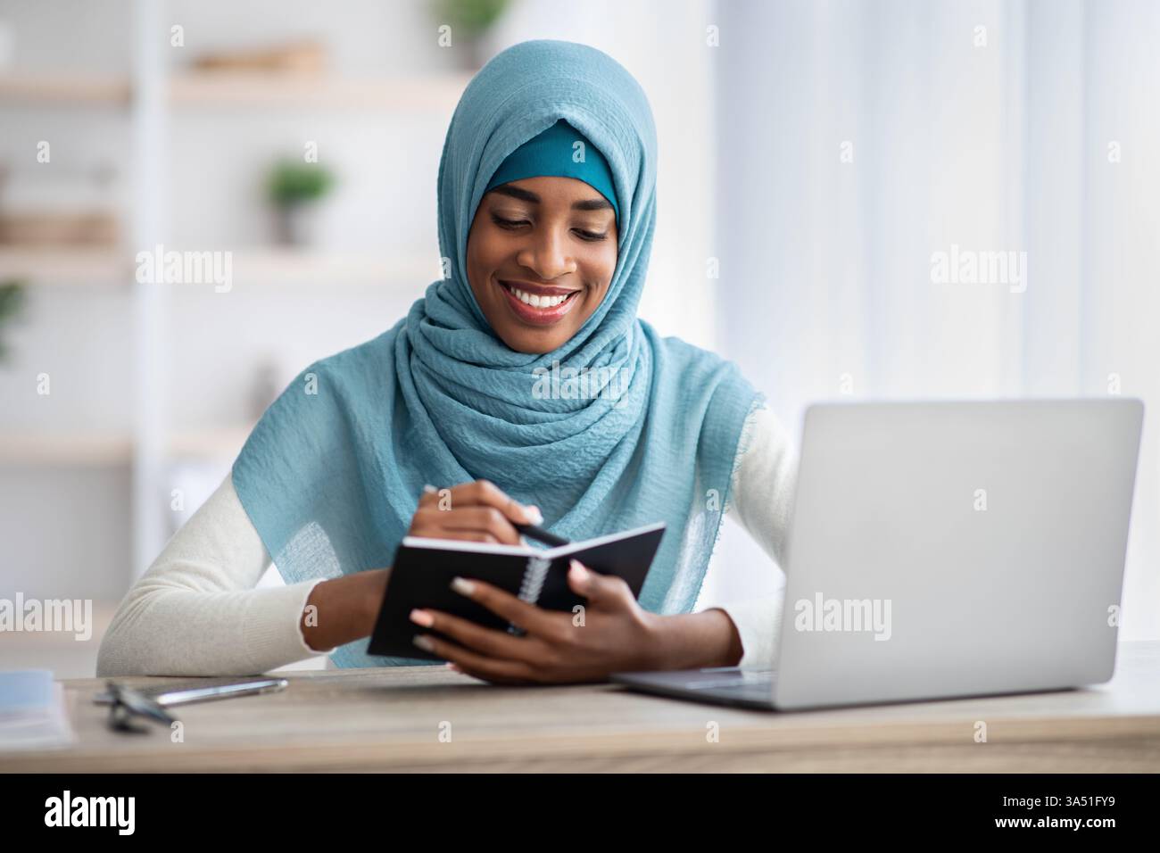 Focused african american muslim hi-res stock photography and images - Alamy