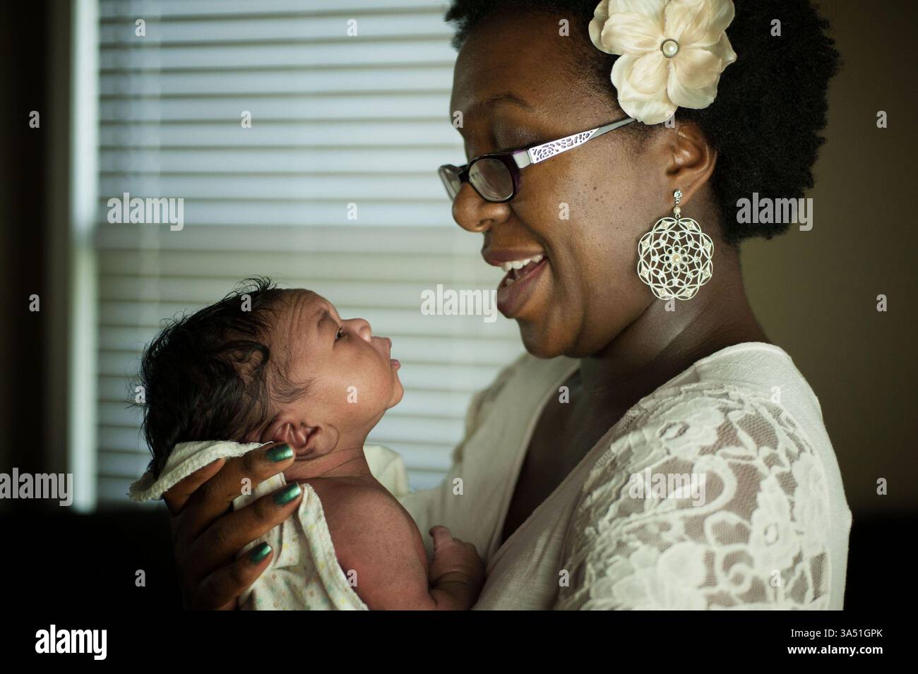 Black mother holding newborn hi-res stock photography and images - Alamy