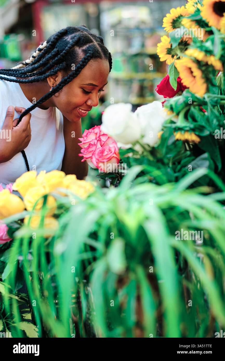 Black woman braids smelling hi-res stock photography and images - Alamy