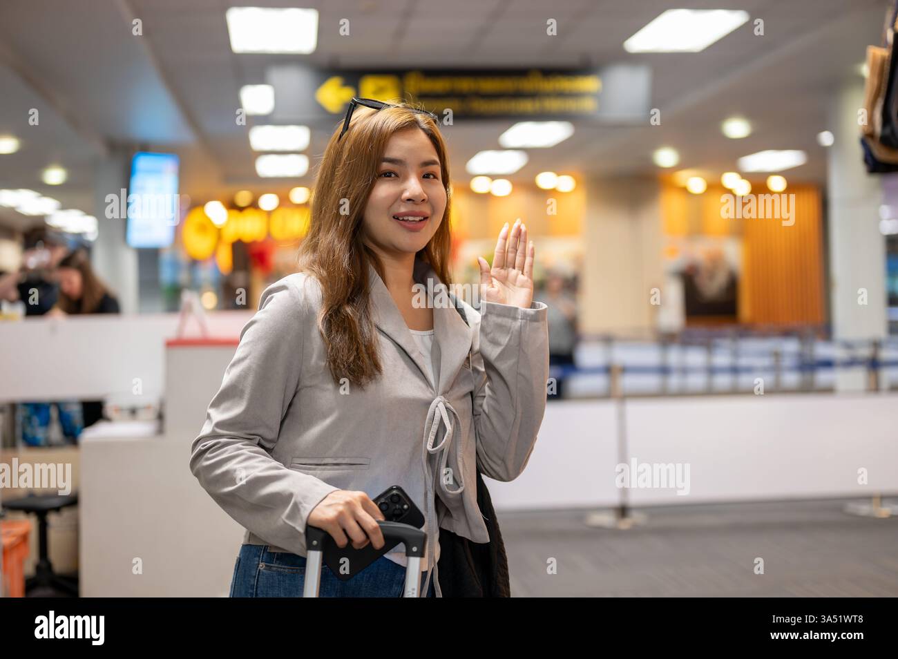Hand waves goodbye airplane airport hi-res stock photography and images ...