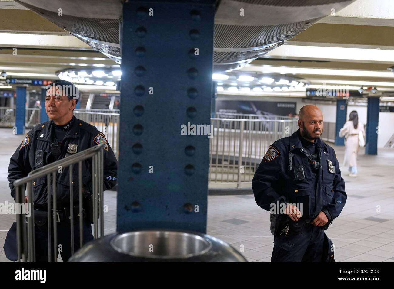 Police officers patrol in a subway station in New York, Thursday, March ...