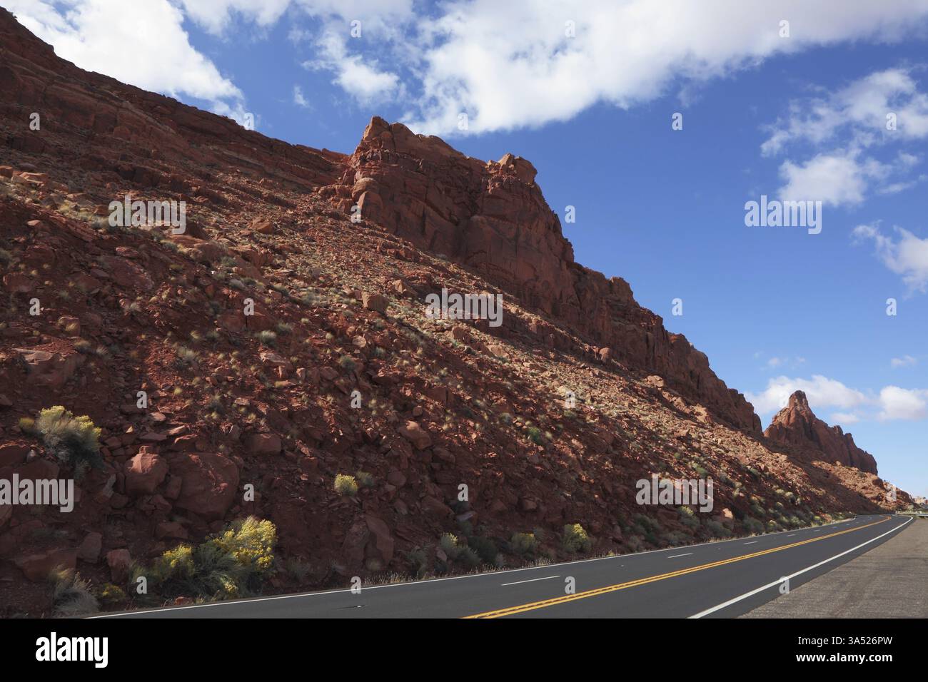 The magnificent American road passes between rocks of red sandstone ...