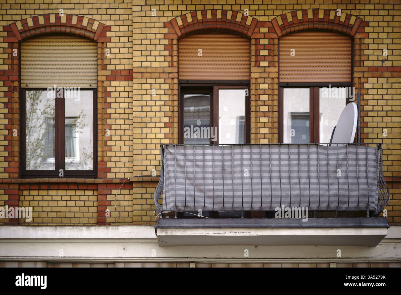 The facade of an old residential building with a clinker brick facade ...
