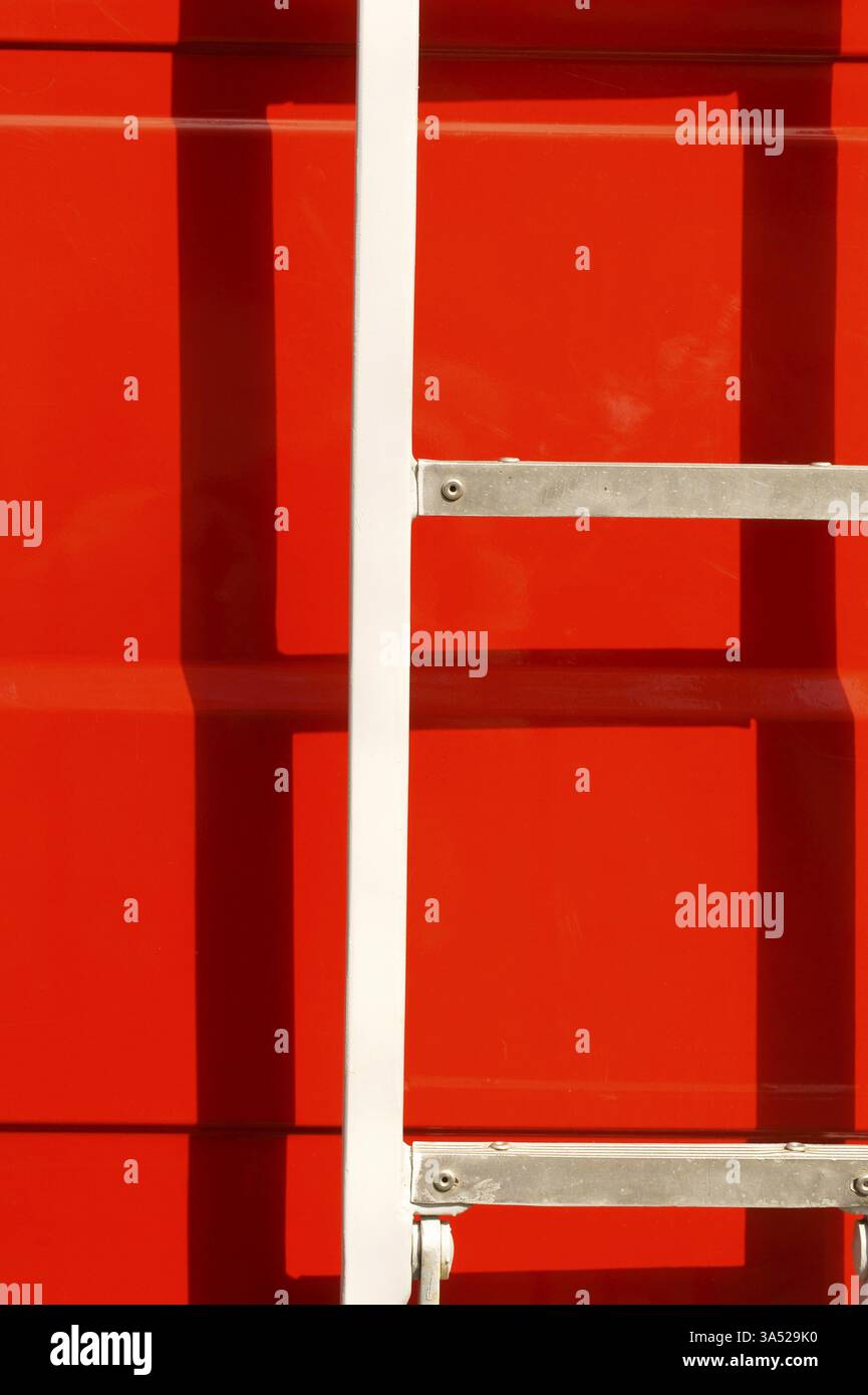 Close-up of the body of a fire engine in the sunshine with a ladder ...