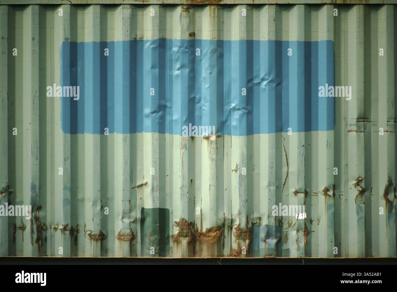 The side view of an old rusty cargo container with repaired and painted ...