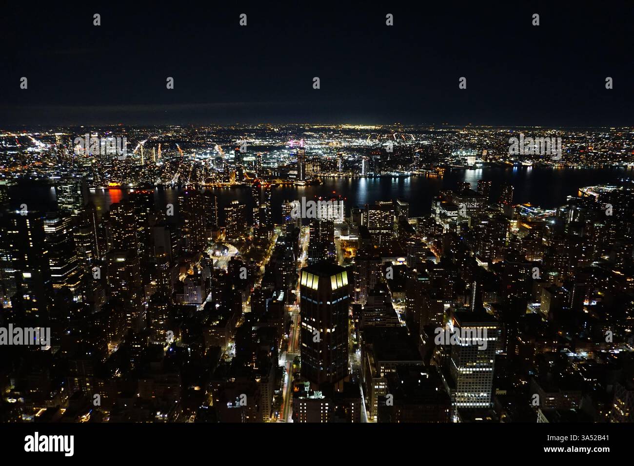 Aerial panorama of New York city at night with the Manhattan ...