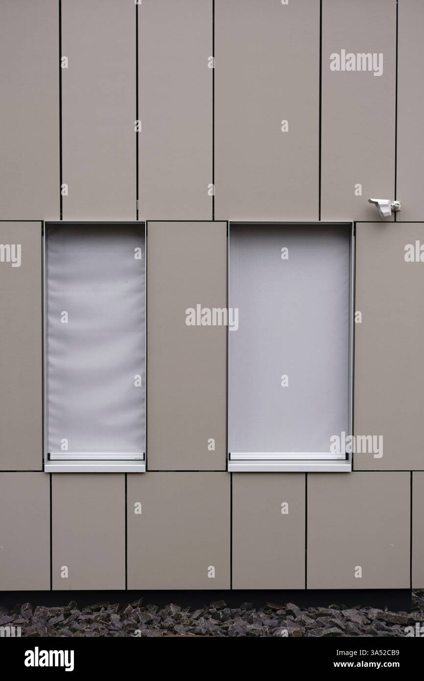 A modern house facade with sheet metal cladding and an installed ...