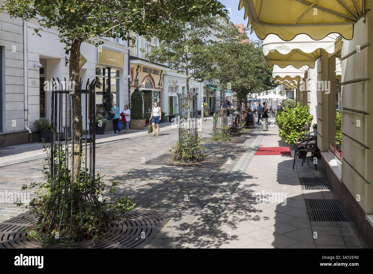Shopping street and pedestrian zone Puschkinstrasse in the old town centre of Schwerin, Mecklenburg-Vorpommern, Germany, Europe Stock Photo