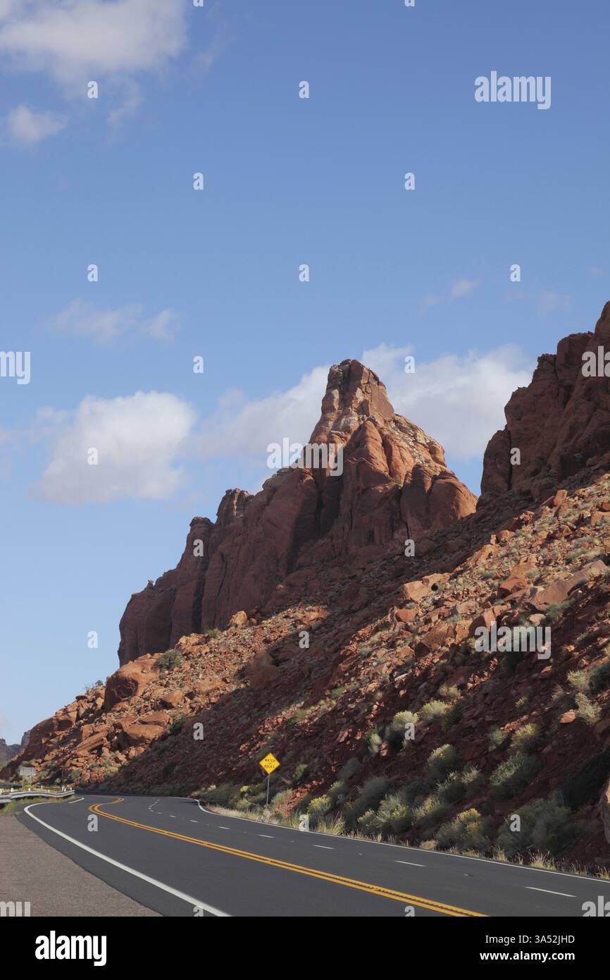 The magnificent American road passes between rocks of red sandstone ...