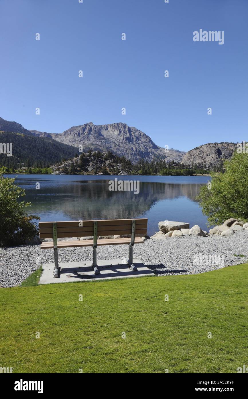 Cosy bench on the shore of Gull Lake. Fine autumn day Stock Photo