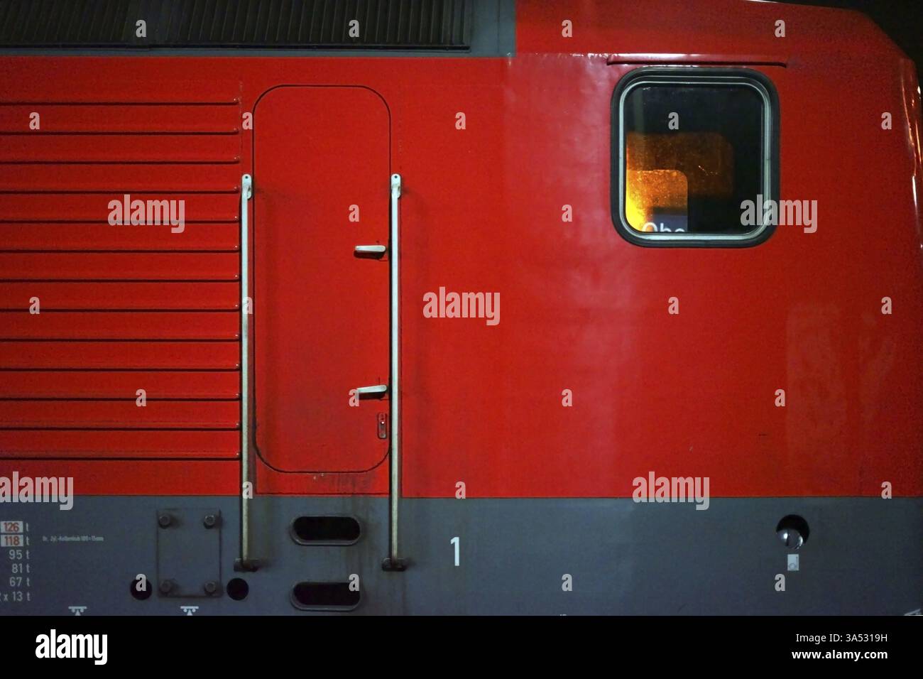 The side view and driver's cab of a red electric locomotive Stock Photo ...