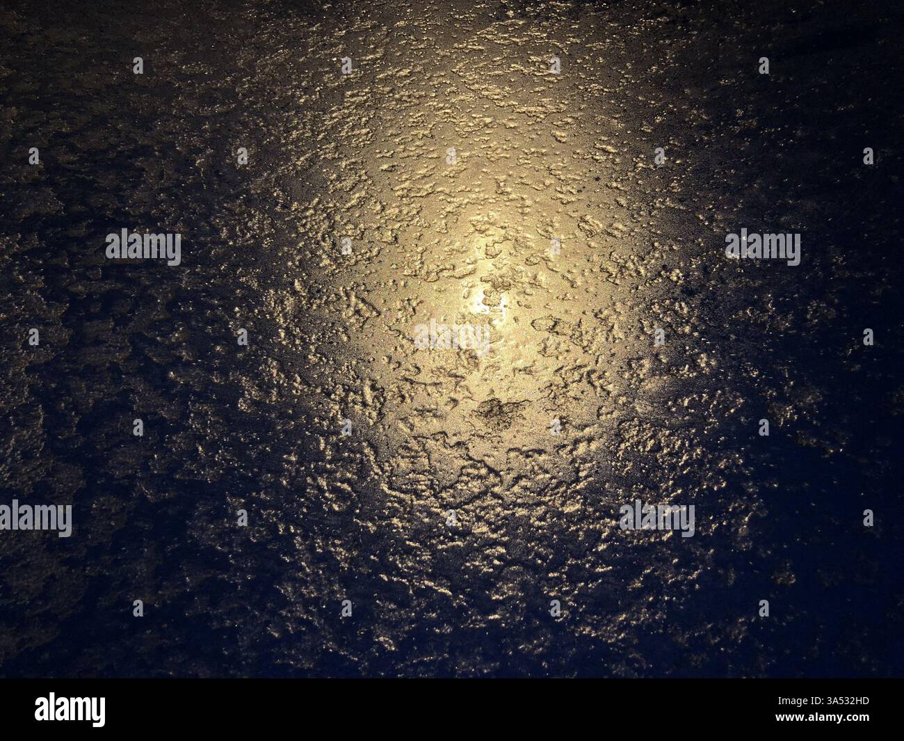 textured ice, golden reflection, abstract background Stock Photo