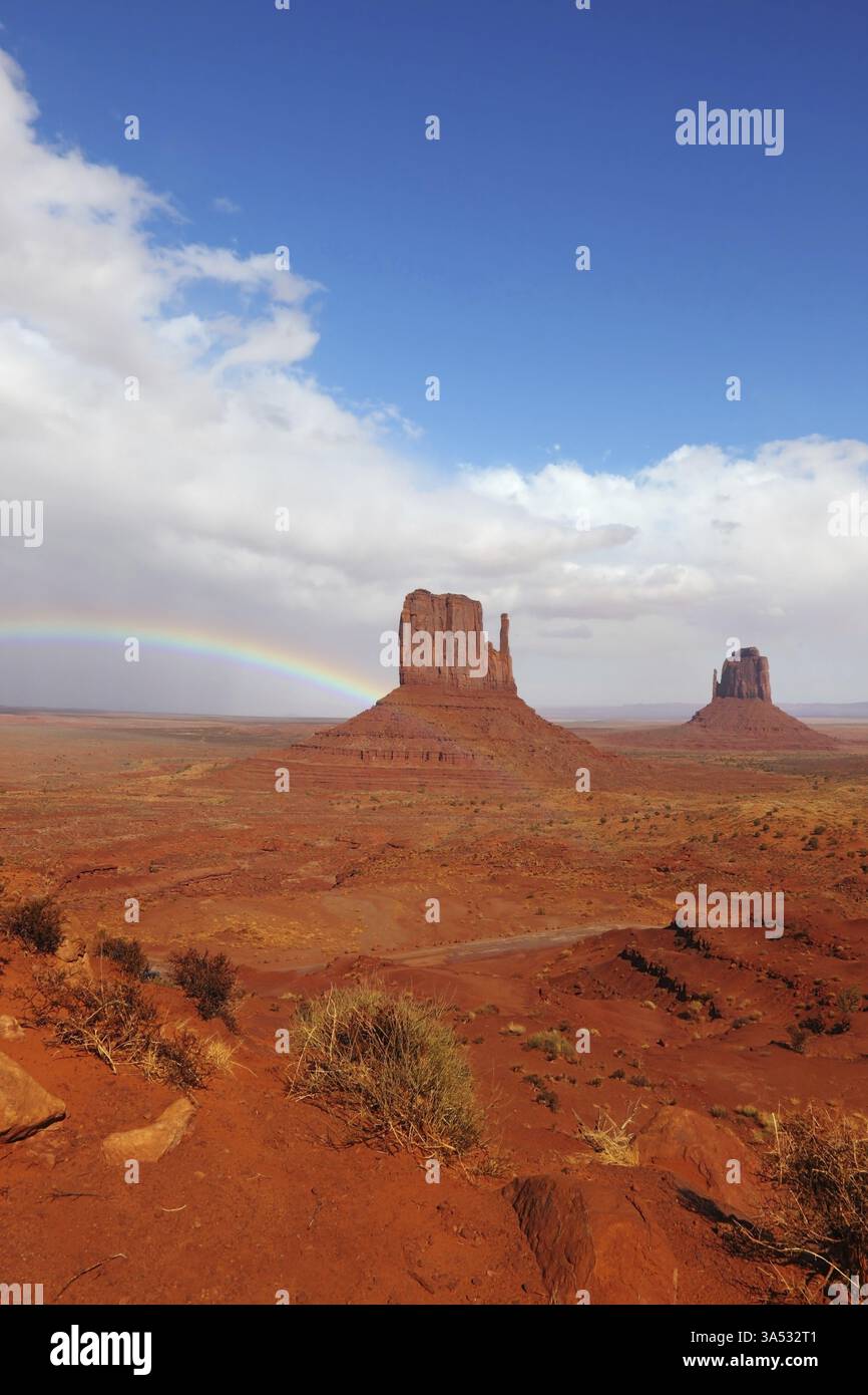 Red Fall Desert Rainbow in a red desert. Monument Valley in the autumn, after rain ...
