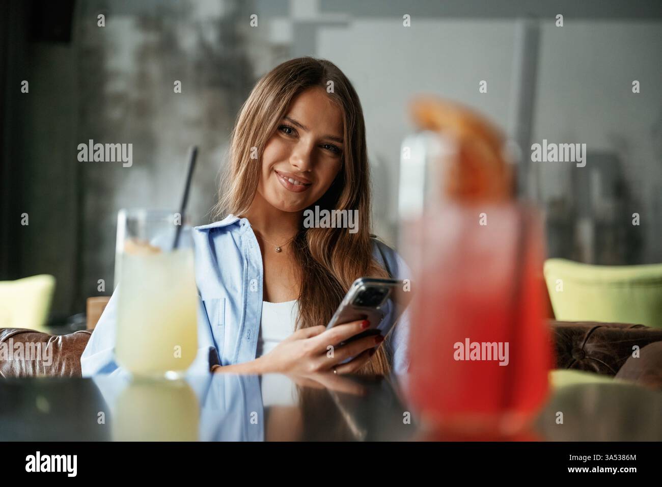 Young beautiful woman is in the restaurant. Stock Photo