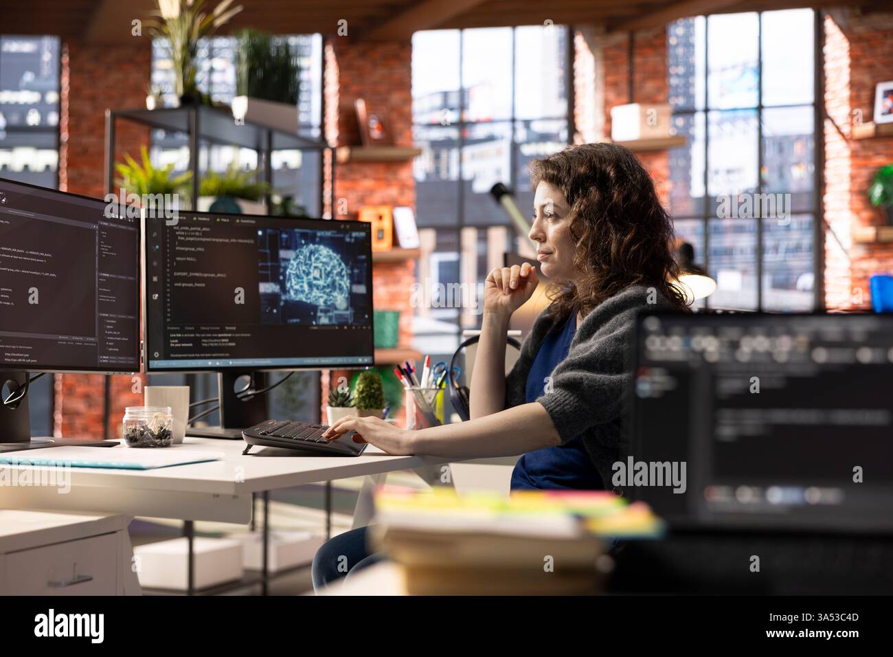 Admin writing code on PC and doing maintenance on artificial intelligence neural networks computerized model. Woman tech support expert doing checkup on AI systems, data science. Stock Photo