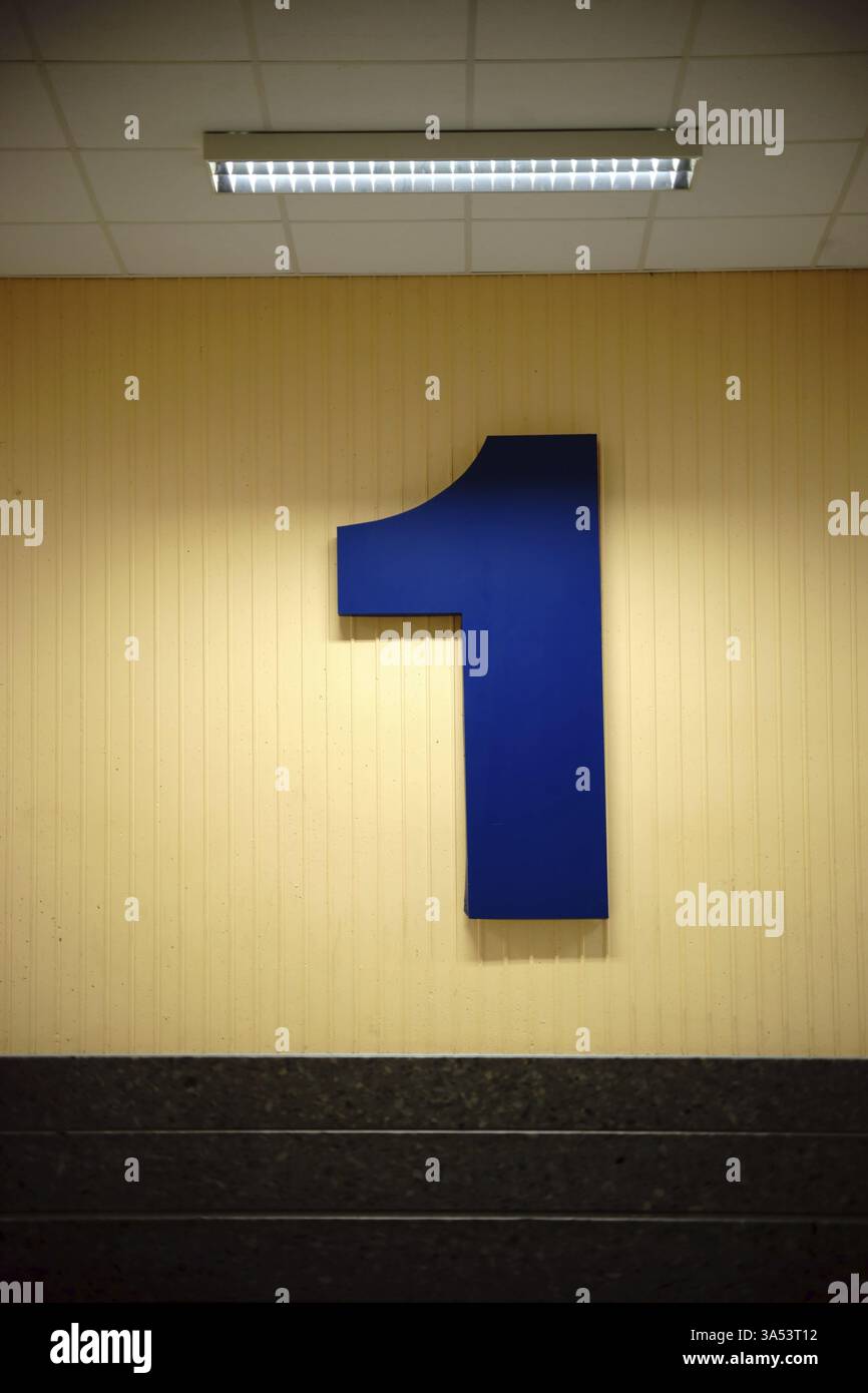 The first floor of a public building with a large number one on the ...