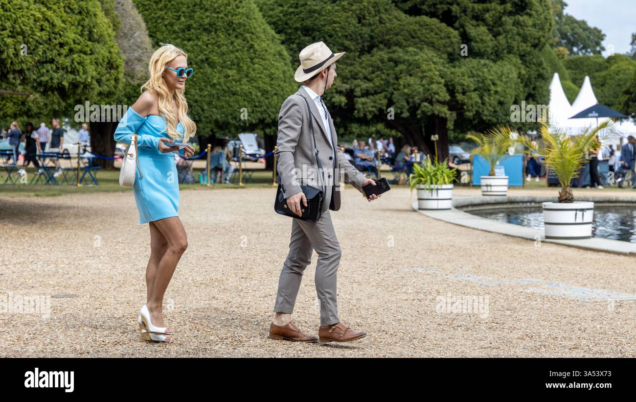 A couple enjoy the exhibits at the Concours of Elegance 2024, London ...