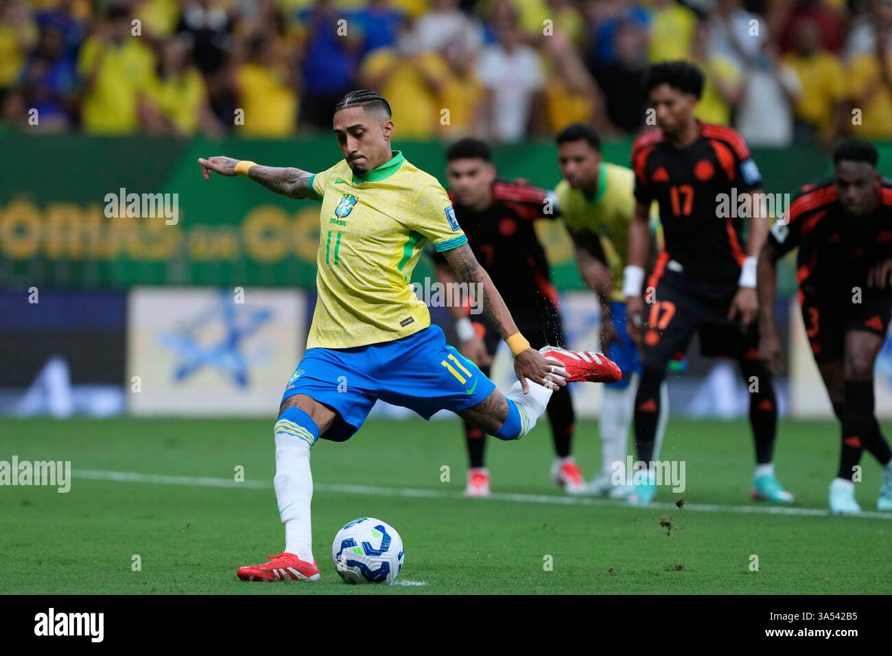 Brazil's Raphinha scores his side's opening goal against Colombia from ...