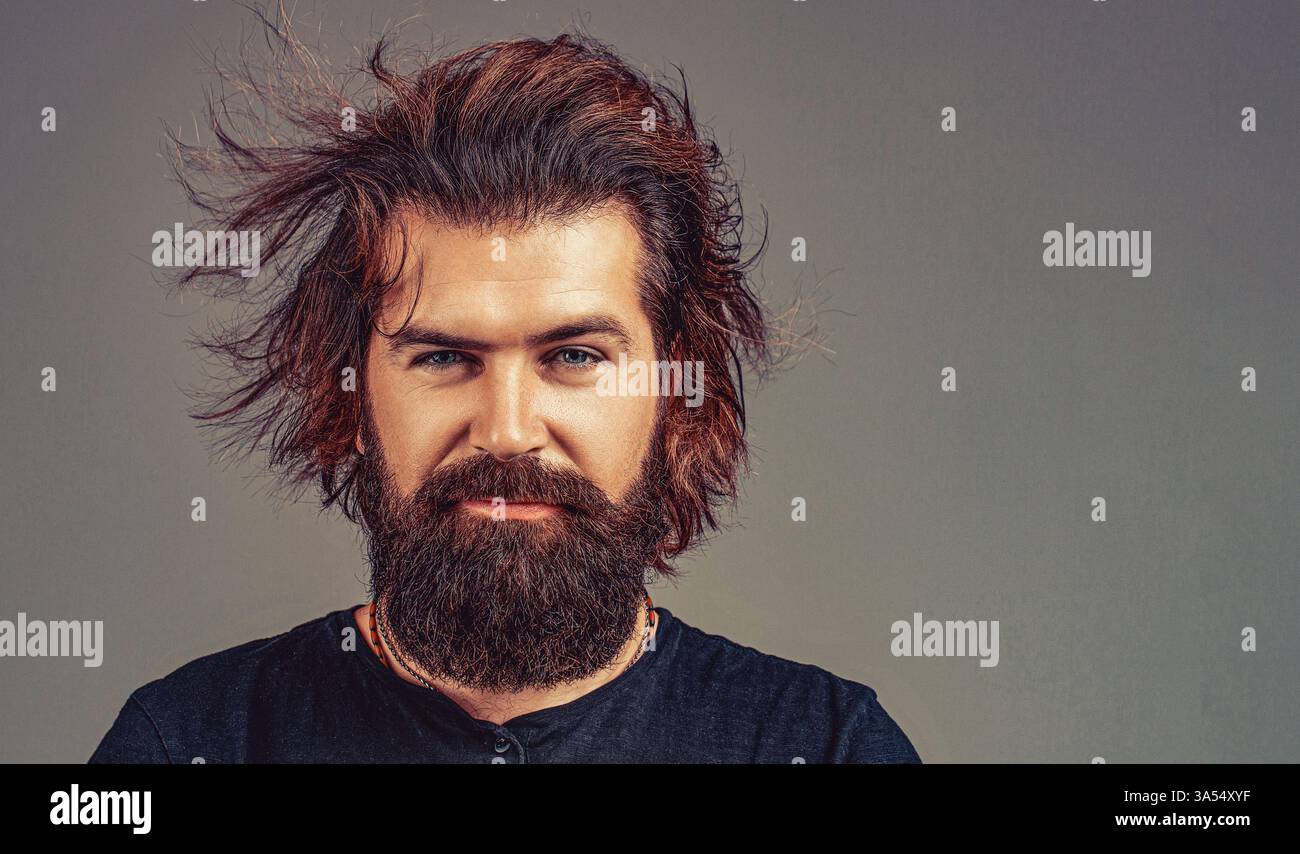 Man haircut in barber shop. Smiling man. Bearded man, stylish hairstyle, beard Stock Photo
