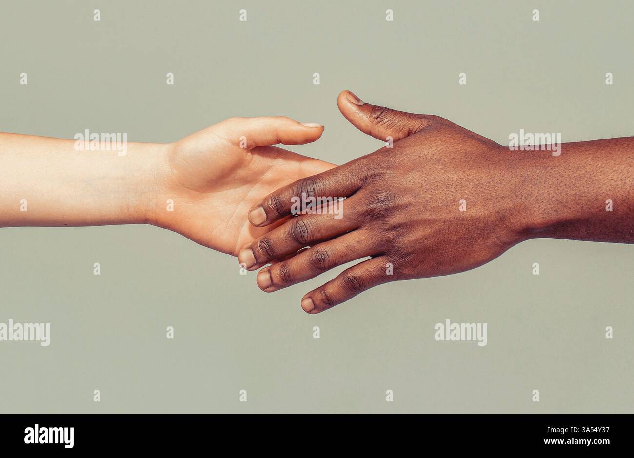 Woman and man holding hands together. Woman and african woman hand ...