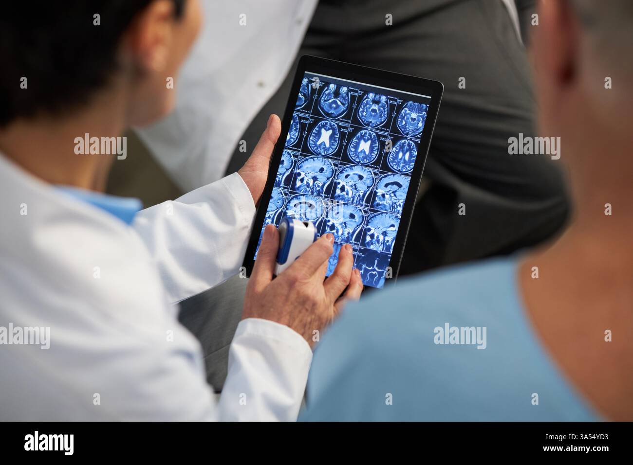 Reviewing patient data on tablet hi-res stock photography and images ...