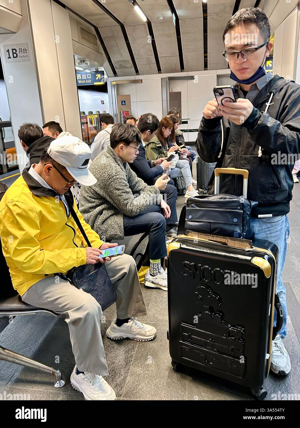 Taipei, Taiwan, Crowd People, Tourists, Traveling, Taipei Main Train Station, Sitting inside, Using Smart Phones, Waiting for High Speed Train - Smartphone Captured Stock Image