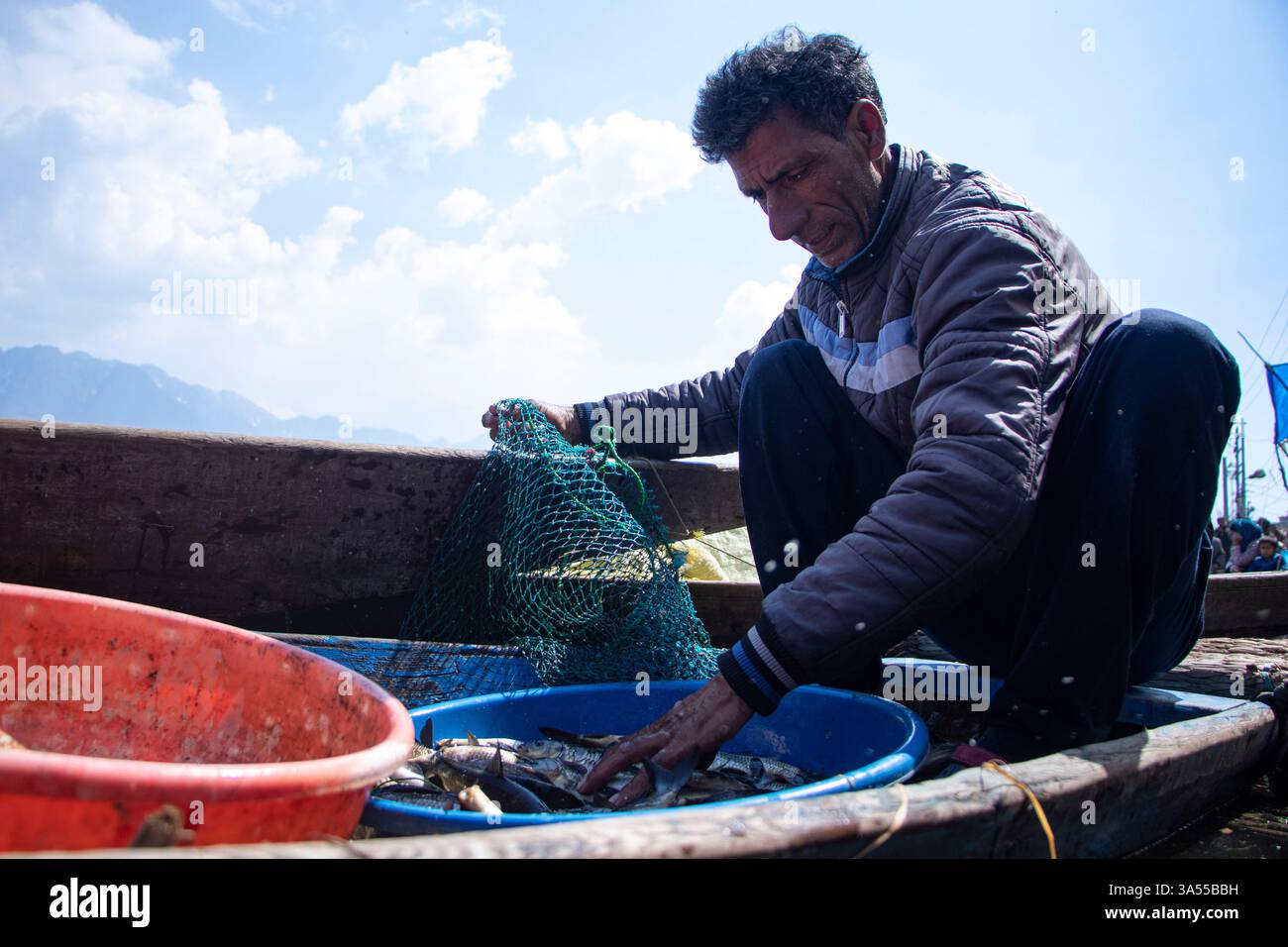 Srinagar, Jammu And Kashmir, India. 21st Mar, 2025. A man is selling ...