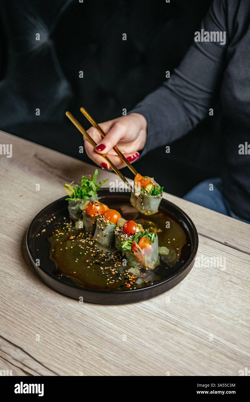 spring rolls in rice paper with soy sauce Stock Photo