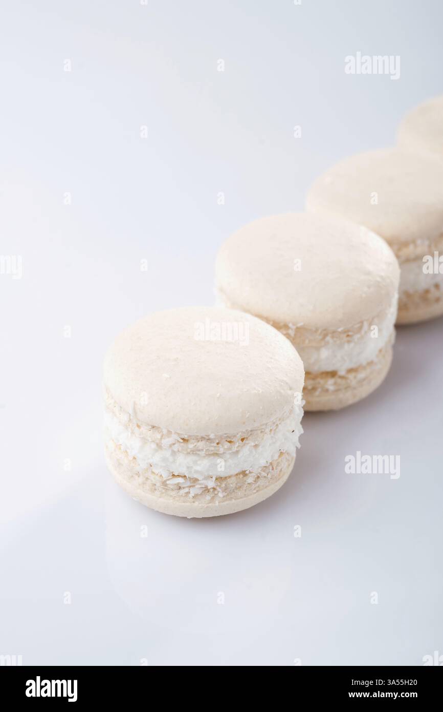 Bunch of macarons on the white surface. Stock Photo