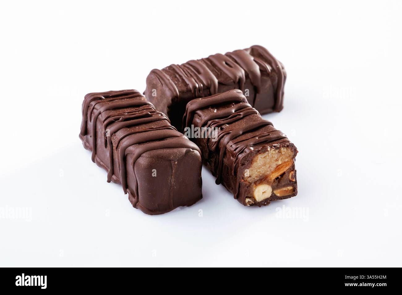 Chocolate bars lie on a white surface, isolated. Stock Photo