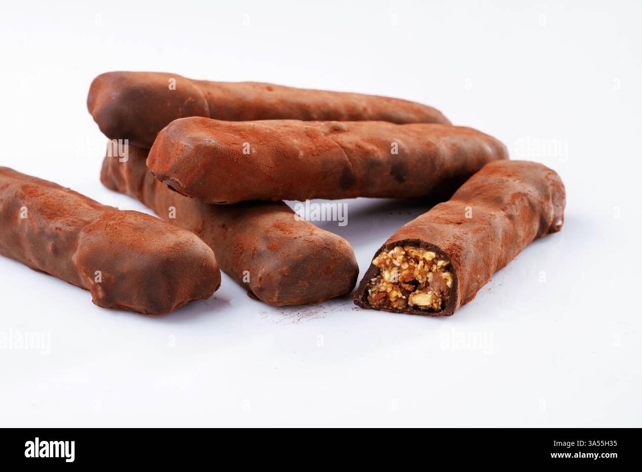 Chocolate bars lie on a white surface, isolated. Stock Photo