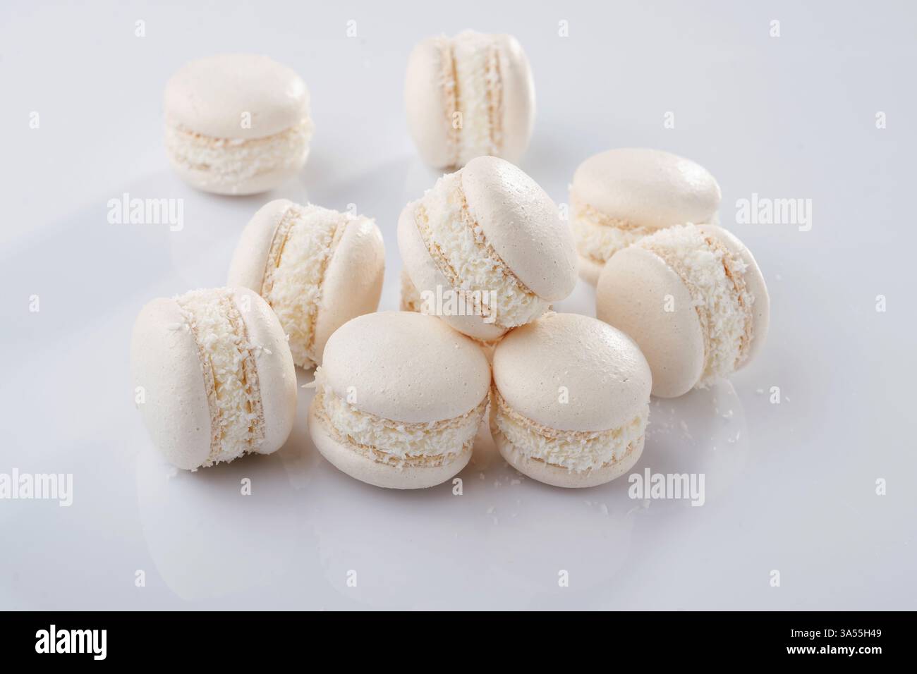 Bunch of macarons on the white surface. Stock Photo