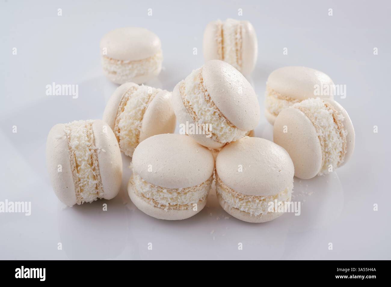 Bunch of macarons on the white surface. Stock Photo