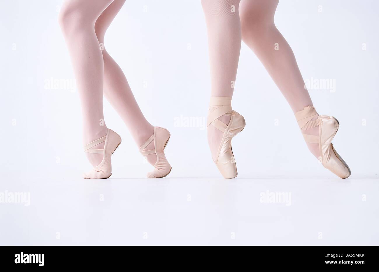 Pointe Movements Close-up of ballet dancers' feet in pointe shoes, performing graceful ...