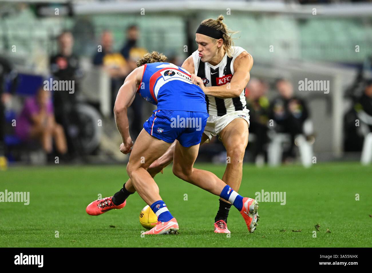 Darcy Moore of Collingwood (right) in action during the AFL Round 2