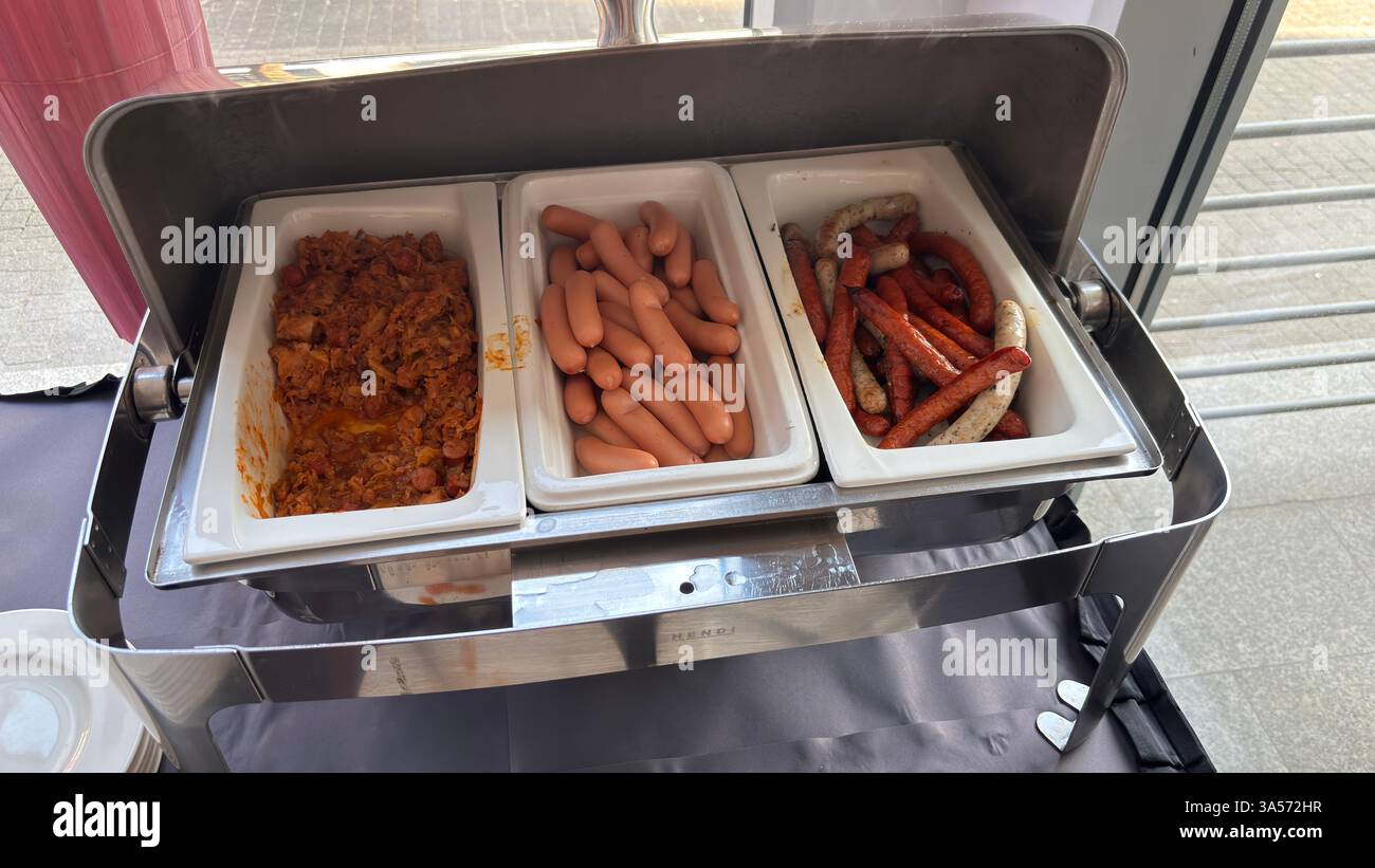 Hot food served in a metal serving plate. Restaurant self service food. Hotel breakfast. Served food. Do it yourself. - Smartphone Captured Stock Image