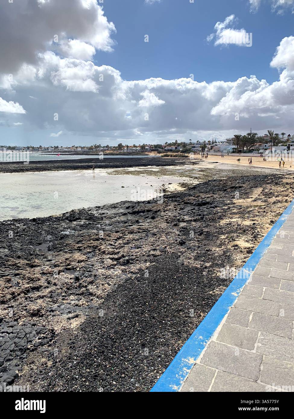 Fuerteventura Canary Island Spain Corralejo island village town outside Vulcanic volcano sea shore people life living tourist tourists clouds Sun - Smartphone Captured Stock Image