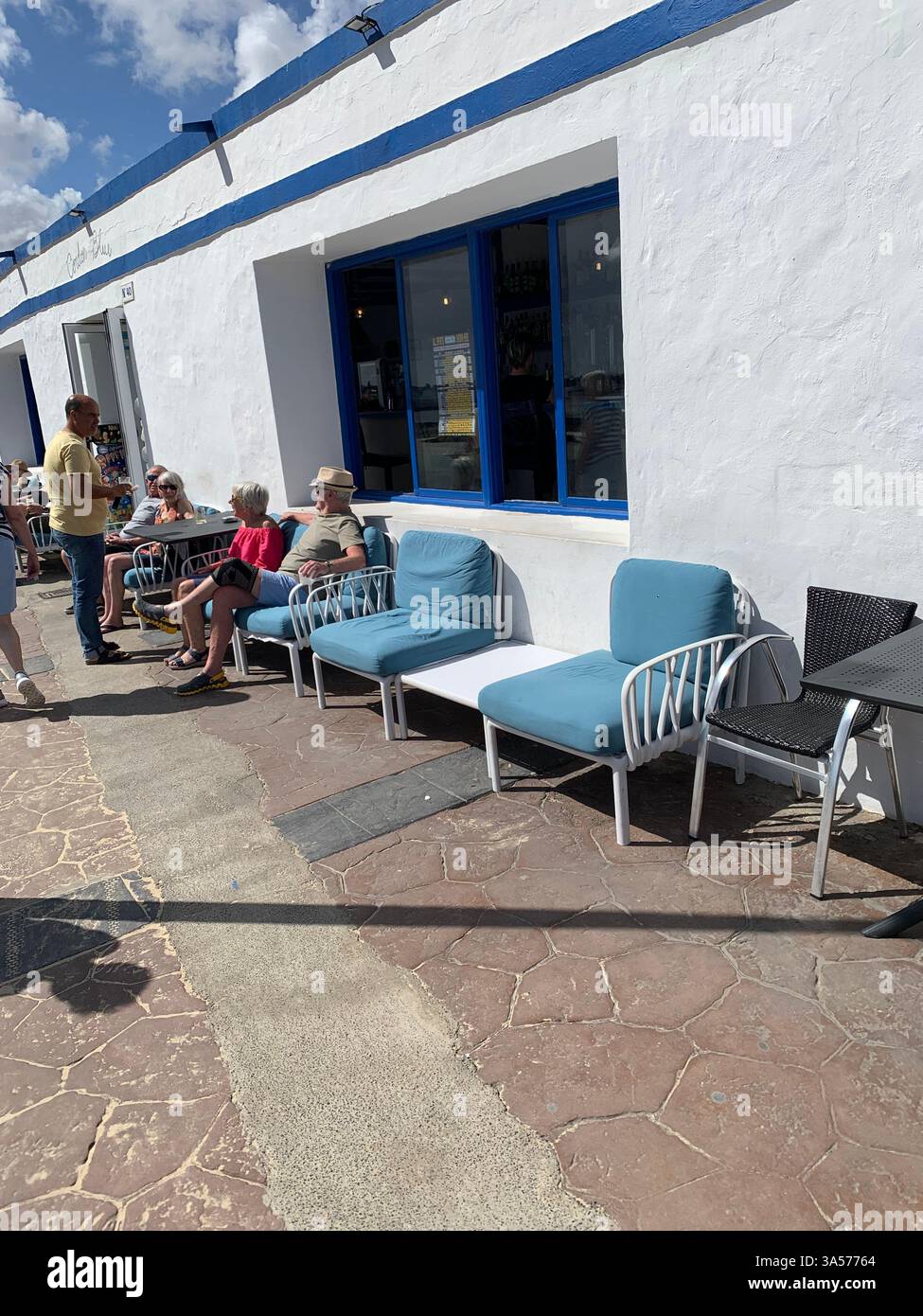 Fuerteventura Canary Island Spain Corralejo island village town outside Vulcanic volcano sea shore people life living tourist tourists clouds Sun - Smartphone Captured Stock Image