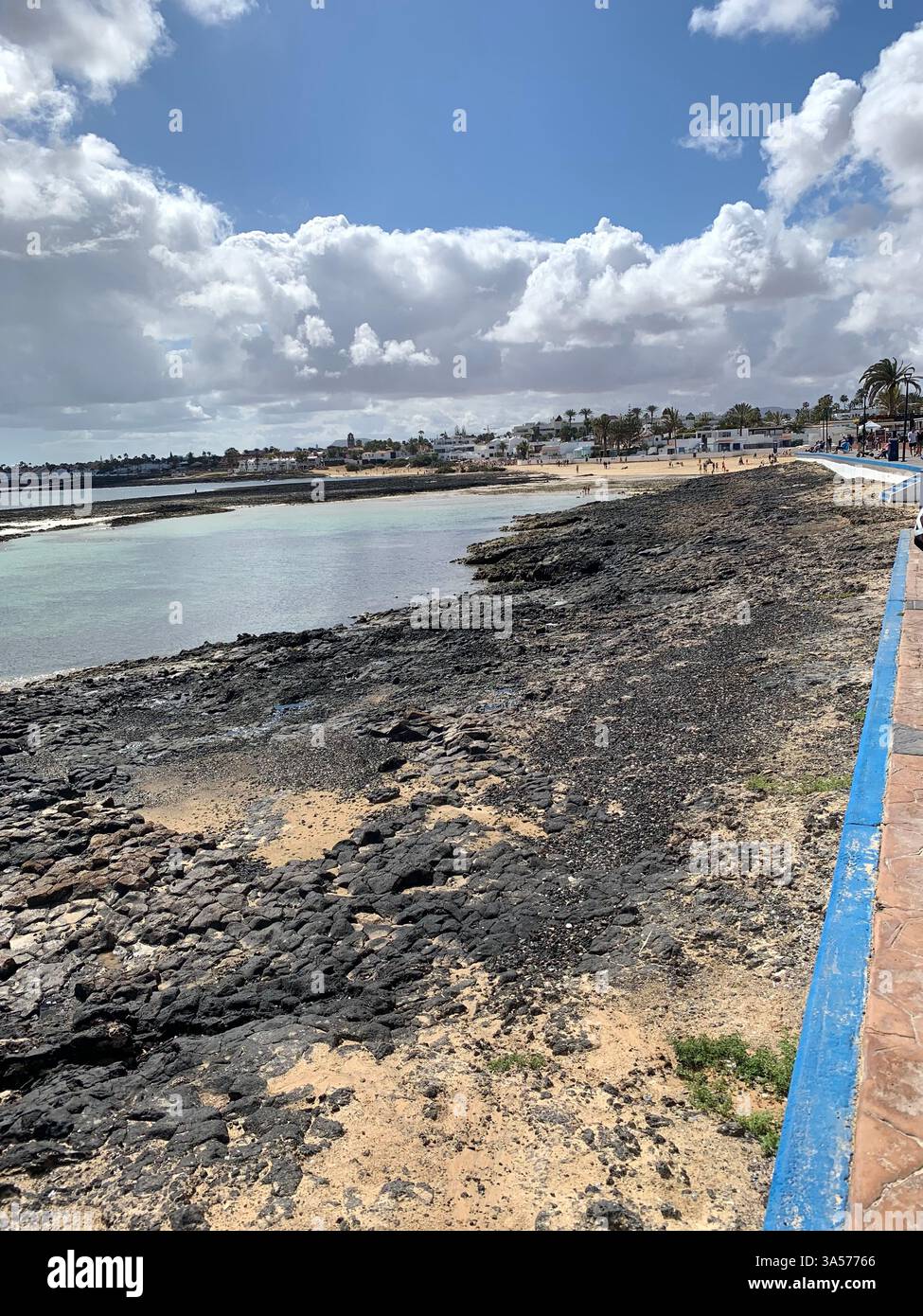 Fuerteventura Canary Island Spain Corralejo island village town outside Vulcanic volcano sea shore people life living tourist tourists clouds Sun - Smartphone Captured Stock Image