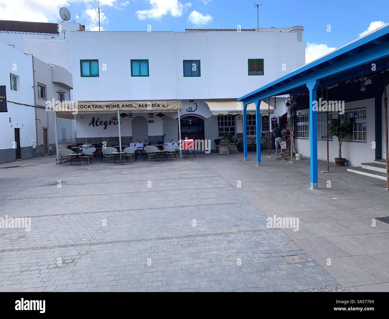 Fuerteventura Canary Island Spain Corralejo island village town outside Vulcanic volcano sea shore people life living tourist tourists clouds Sun - Smartphone Captured Stock Image