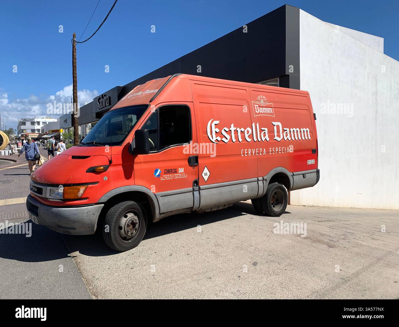 beer truck van red bottled Estrela load loading unload driver drive Tenerife hot sunny weather cold beer bottled bottles vehicle deliver bar booze - Smartphone Captured Stock Image