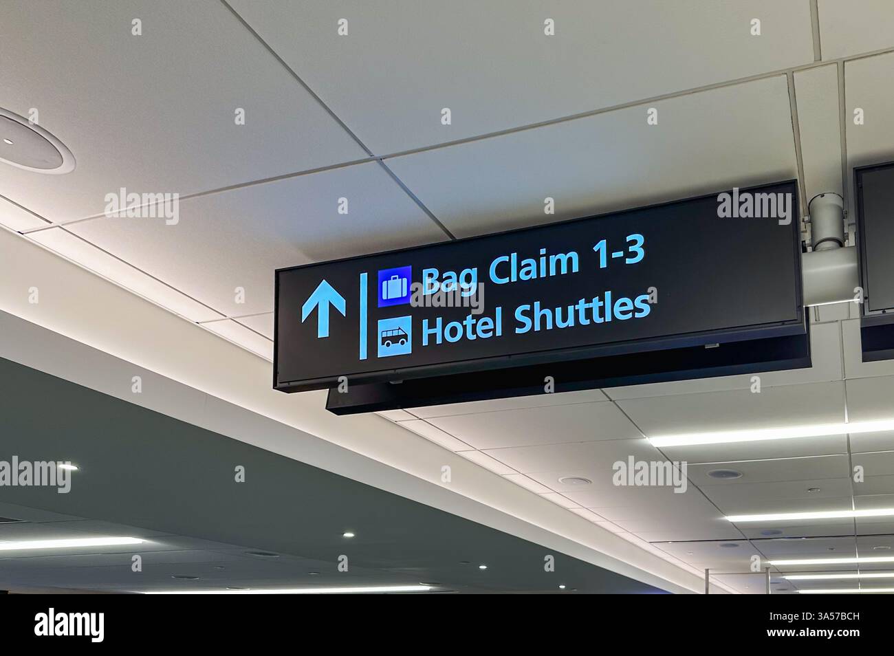 Bag claim and hotel shuttles sign in an airport - Smartphone Captured Stock Image